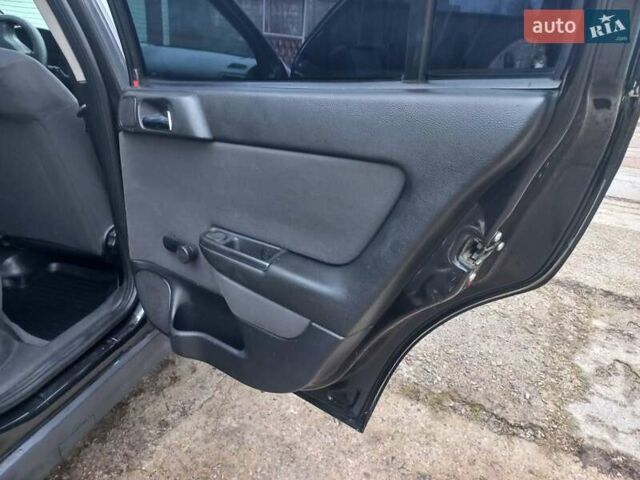 Черный Опель Астра, объемом двигателя 1.4 л и пробегом 230 тыс. км за 4500 $, фото 20 на Automoto.ua