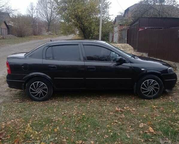 Черный Опель Астра, объемом двигателя 1.4 л и пробегом 340 тыс. км за 4100 $, фото 2 на Automoto.ua