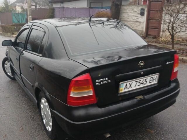 Черный Опель Астра, объемом двигателя 1.4 л и пробегом 362 тыс. км за 2600 $, фото 3 на Automoto.ua