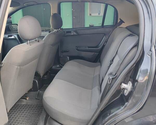 Черный Опель Астра, объемом двигателя 1.6 л и пробегом 100 тыс. км за 2800 $, фото 5 на Automoto.ua