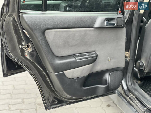 Черный Опель Астра, объемом двигателя 1.4 л и пробегом 157 тыс. км за 2500 $, фото 10 на Automoto.ua