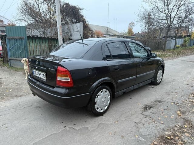 Черный Опель Астра, объемом двигателя 1.6 л и пробегом 250 тыс. км за 3750 $, фото 7 на Automoto.ua
