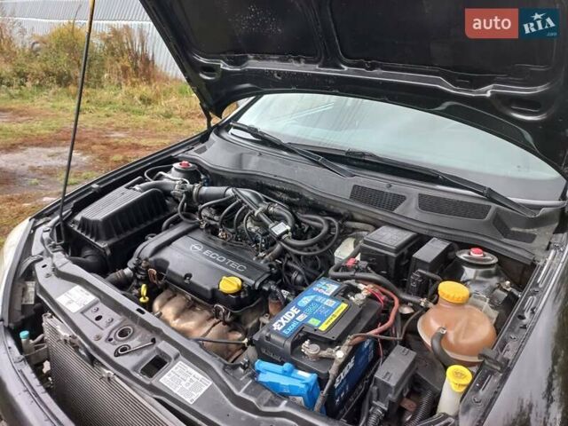 Черный Опель Астра, объемом двигателя 1.4 л и пробегом 220 тыс. км за 4500 $, фото 8 на Automoto.ua