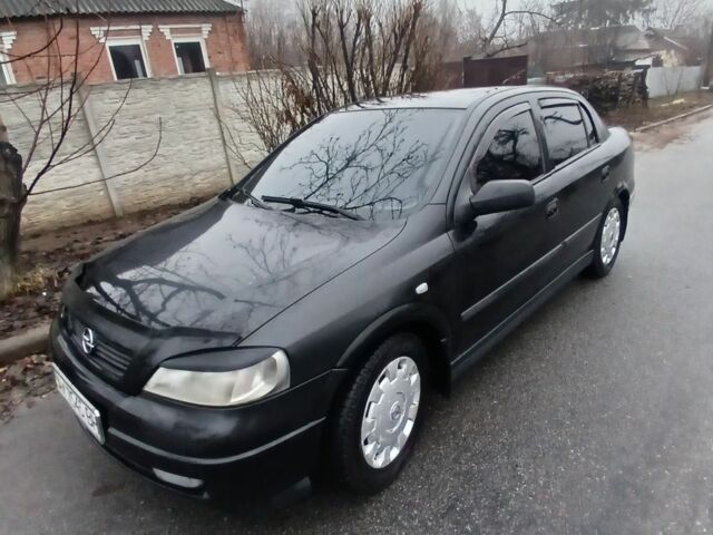 Черный Опель Астра, объемом двигателя 1.4 л и пробегом 362 тыс. км за 2600 $, фото 4 на Automoto.ua