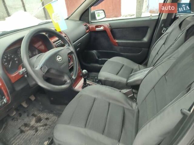 Черный Опель Астра, объемом двигателя 1.36 л и пробегом 300 тыс. км за 2150 $, фото 7 на Automoto.ua