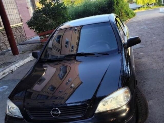 Черный Опель Астра, объемом двигателя 1.4 л и пробегом 176 тыс. км за 3850 $, фото 2 на Automoto.ua