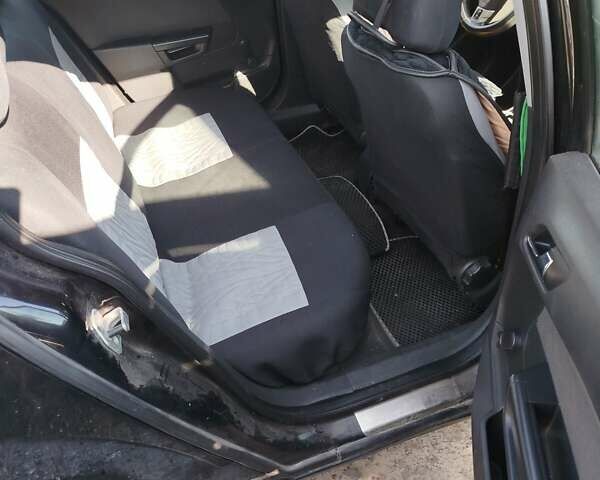 Черный Опель Астра, объемом двигателя 1.6 л и пробегом 322 тыс. км за 4300 $, фото 1 на Automoto.ua