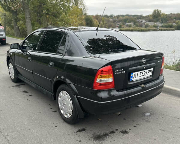 Черный Опель Астра, объемом двигателя 1.36 л и пробегом 193 тыс. км за 3700 $, фото 6 на Automoto.ua