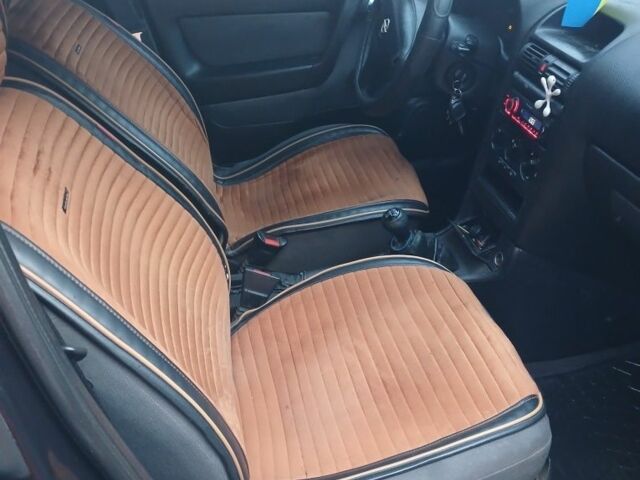 Черный Опель Астра, объемом двигателя 1.4 л и пробегом 362 тыс. км за 2600 $, фото 9 на Automoto.ua