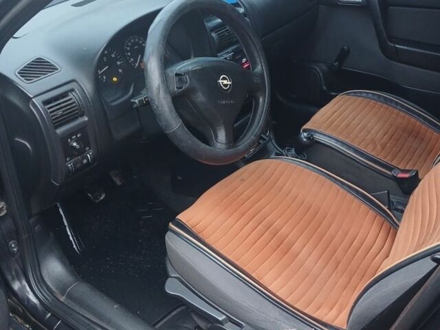 Черный Опель Астра, объемом двигателя 1.4 л и пробегом 362 тыс. км за 2600 $, фото 6 на Automoto.ua