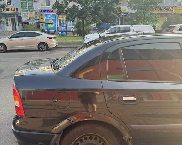 Черный Опель Астра, объемом двигателя 1.6 л и пробегом 300 тыс. км за 3500 $, фото 3 на Automoto.ua