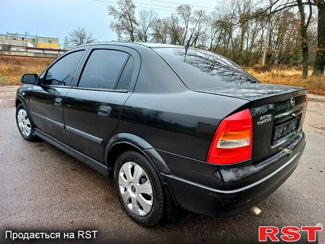 Черный Опель Астра, объемом двигателя 1.4 л и пробегом 230 тыс. км за 4200 $, фото 4 на Automoto.ua