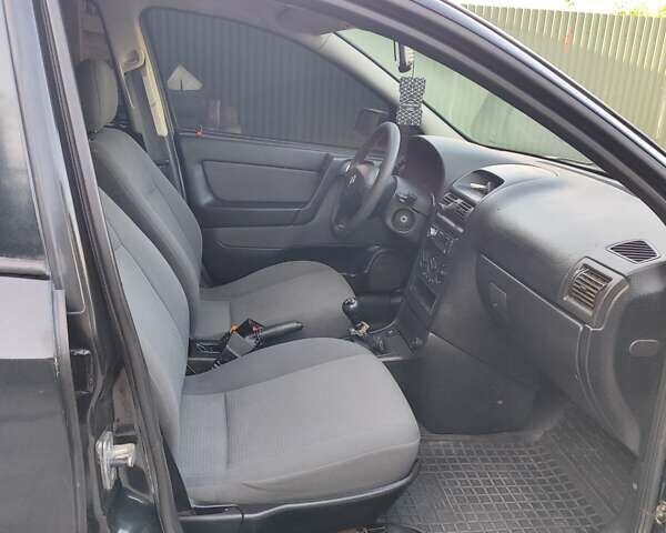 Черный Опель Астра, объемом двигателя 1.6 л и пробегом 100 тыс. км за 2800 $, фото 11 на Automoto.ua