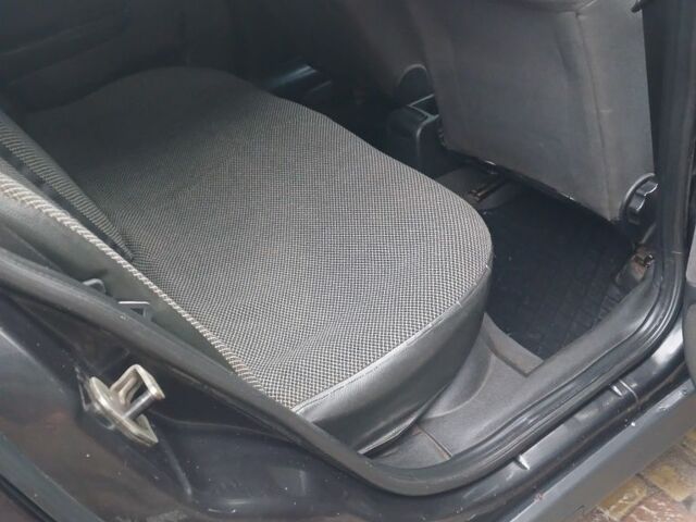 Черный Опель Астра, объемом двигателя 1.4 л и пробегом 362 тыс. км за 2600 $, фото 8 на Automoto.ua