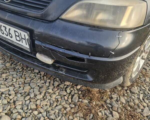 Черный Опель Астра, объемом двигателя 1.39 л и пробегом 180 тыс. км за 2550 $, фото 8 на Automoto.ua