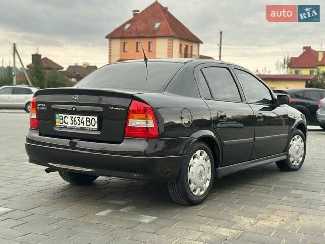 Черный Опель Астра, объемом двигателя 1.4 л и пробегом 216 тыс. км за 3999 $, фото 6 на Automoto.ua