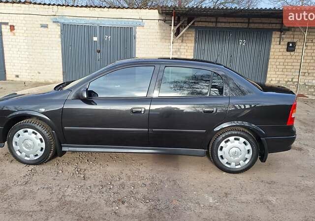 Чорний Опель Астра, об'ємом двигуна 1.6 л та пробігом 52 тис. км за 5600 $, фото 1 на Automoto.ua