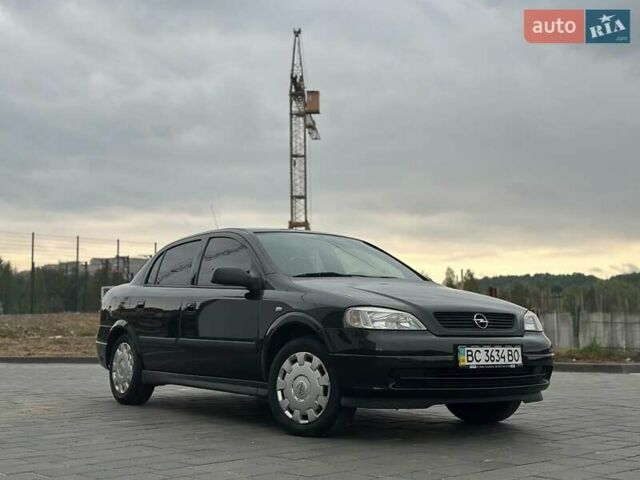 Черный Опель Астра, объемом двигателя 1.4 л и пробегом 216 тыс. км за 3999 $, фото 4 на Automoto.ua