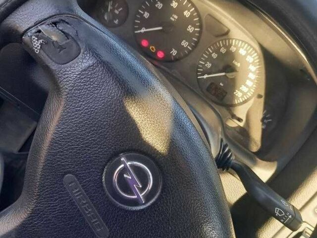 Черный Опель Астра, объемом двигателя 1.4 л и пробегом 169 тыс. км за 4650 $, фото 5 на Automoto.ua