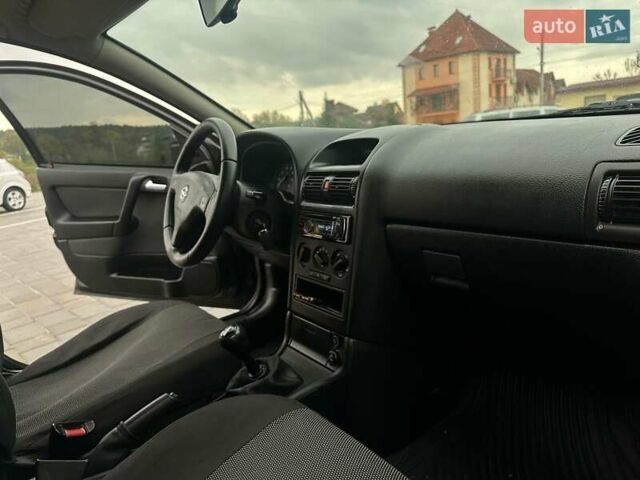 Черный Опель Астра, объемом двигателя 1.4 л и пробегом 216 тыс. км за 3999 $, фото 21 на Automoto.ua