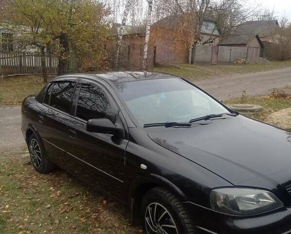 Черный Опель Астра, объемом двигателя 1.4 л и пробегом 340 тыс. км за 4100 $, фото 1 на Automoto.ua