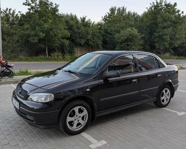 Черный Опель Астра, объемом двигателя 1.6 л и пробегом 215 тыс. км за 3900 $, фото 1 на Automoto.ua