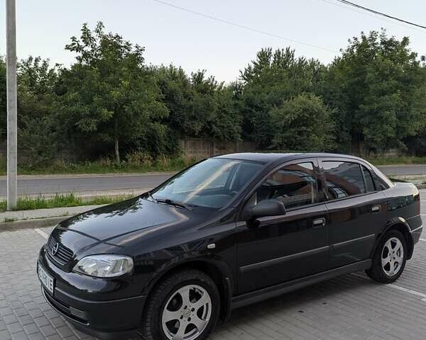 Черный Опель Астра, объемом двигателя 1.6 л и пробегом 215 тыс. км за 3900 $, фото 2 на Automoto.ua