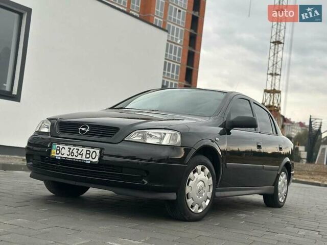 Черный Опель Астра, объемом двигателя 1.4 л и пробегом 216 тыс. км за 3999 $, фото 12 на Automoto.ua