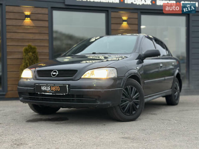 Черный Опель Астра, объемом двигателя 1.4 л и пробегом 102 тыс. км за 3600 $, фото 3 на Automoto.ua