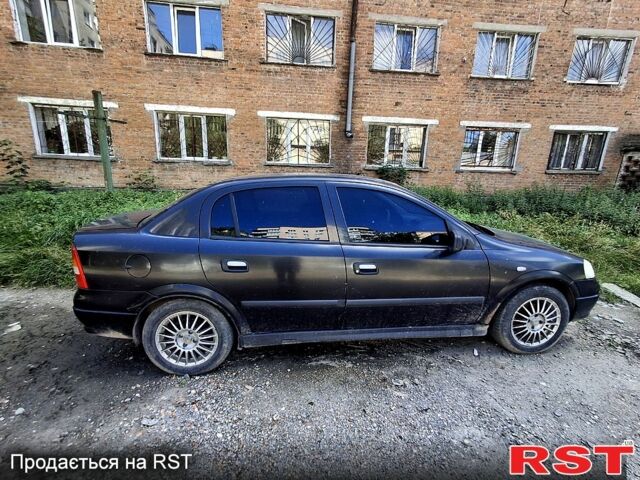 Черный Опель Астра, объемом двигателя 1.4 л и пробегом 300 тыс. км за 1300 $, фото 4 на Automoto.ua