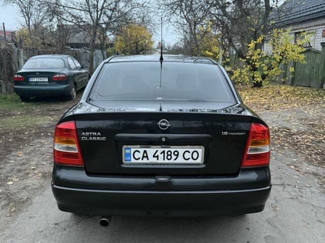 Черный Опель Астра, объемом двигателя 1.6 л и пробегом 250 тыс. км за 3750 $, фото 4 на Automoto.ua