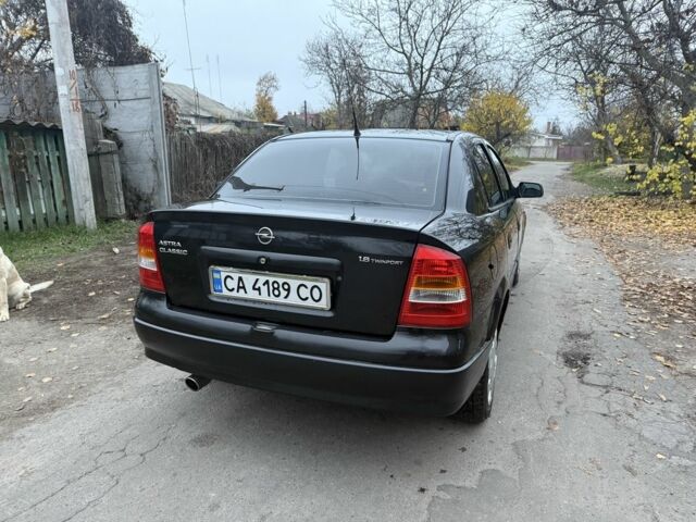 Черный Опель Астра, объемом двигателя 1.6 л и пробегом 250 тыс. км за 3750 $, фото 5 на Automoto.ua