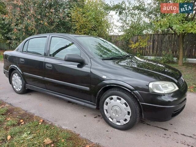 Черный Опель Астра, объемом двигателя 1.4 л и пробегом 220 тыс. км за 4500 $, фото 1 на Automoto.ua