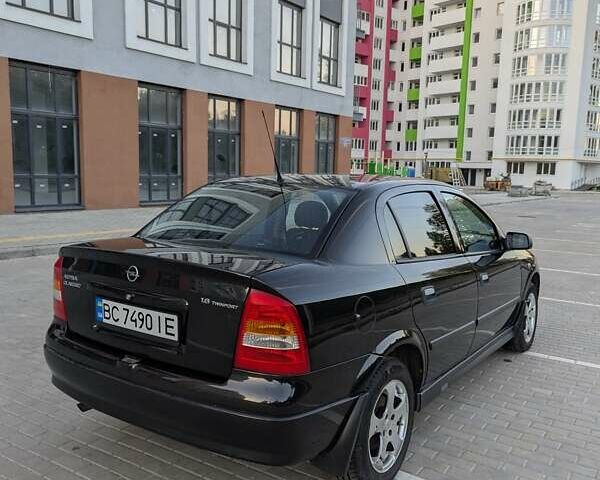Черный Опель Астра, объемом двигателя 1.6 л и пробегом 215 тыс. км за 3900 $, фото 7 на Automoto.ua