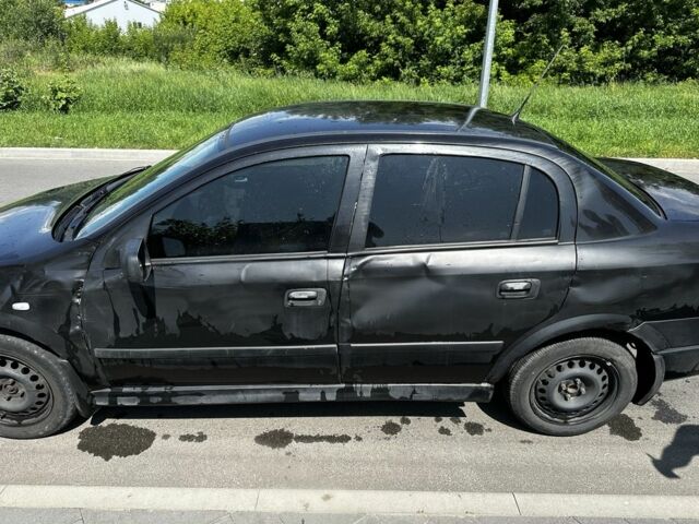 Черный Опель Астра, объемом двигателя 1.4 л и пробегом 191 тыс. км за 3000 $, фото 2 на Automoto.ua
