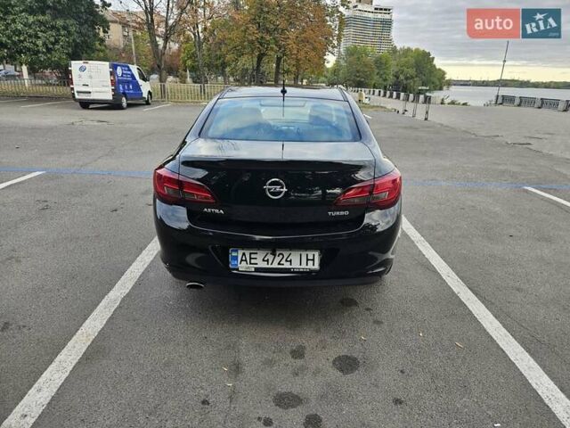 Черный Опель Астра, объемом двигателя 1.4 л и пробегом 70 тыс. км за 11500 $, фото 2 на Automoto.ua