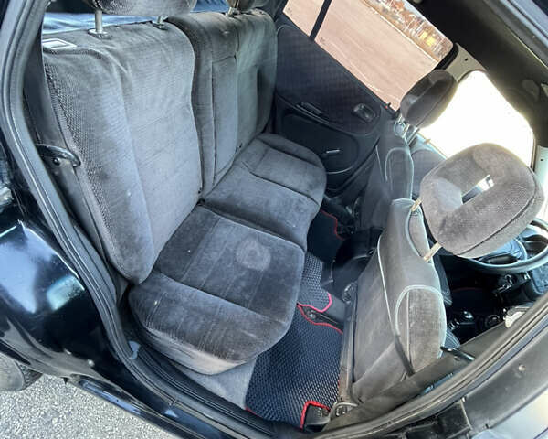 Черный Опель Астра, объемом двигателя 1.7 л и пробегом 590 тыс. км за 2400 $, фото 11 на Automoto.ua