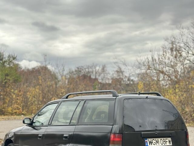 Черный Опель Астра, объемом двигателя 1.6 л и пробегом 341 тыс. км за 1000 $, фото 3 на Automoto.ua