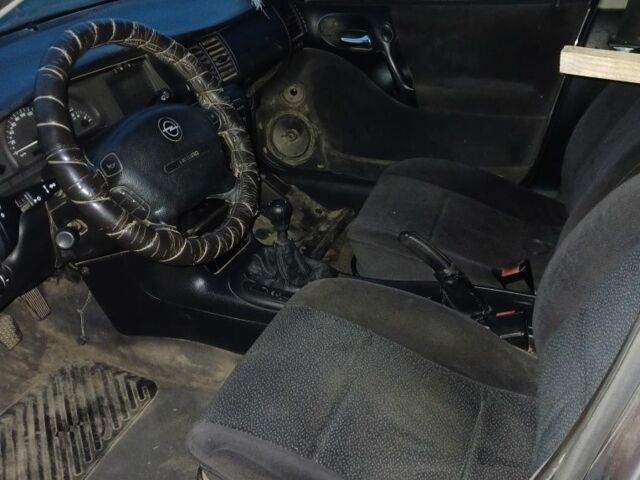 Черный Опель Астра, объемом двигателя 2 л и пробегом 200 тыс. км за 237 $, фото 1 на Automoto.ua