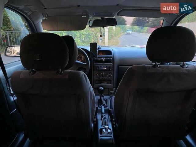 Черный Опель Астра, объемом двигателя 1.6 л и пробегом 248 тыс. км за 3200 $, фото 10 на Automoto.ua