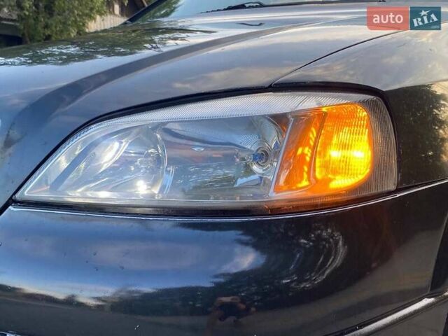 Черный Опель Астра, объемом двигателя 1.6 л и пробегом 248 тыс. км за 3200 $, фото 1 на Automoto.ua