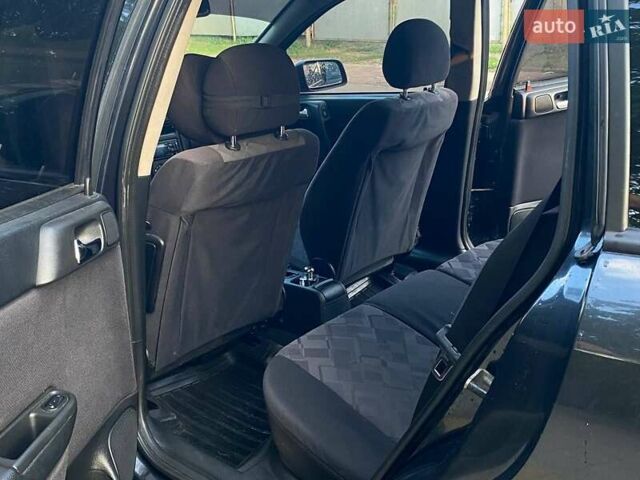 Черный Опель Астра, объемом двигателя 1.6 л и пробегом 248 тыс. км за 3200 $, фото 4 на Automoto.ua