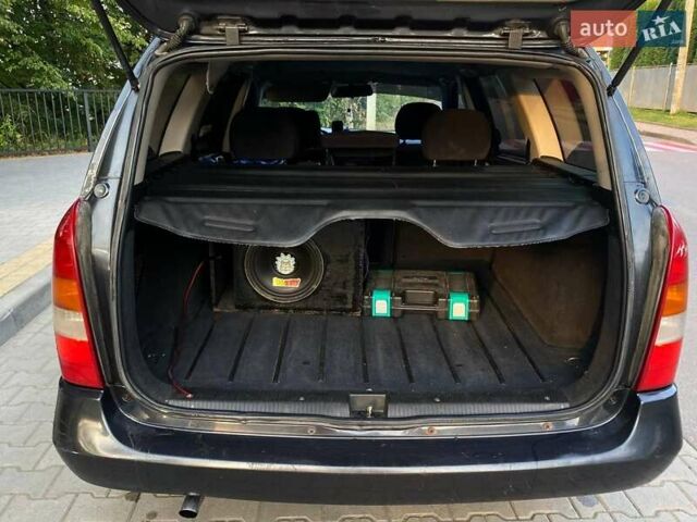 Черный Опель Астра, объемом двигателя 1.6 л и пробегом 248 тыс. км за 3200 $, фото 2 на Automoto.ua