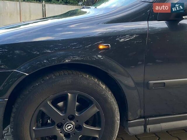 Черный Опель Астра, объемом двигателя 1.6 л и пробегом 248 тыс. км за 3200 $, фото 5 на Automoto.ua