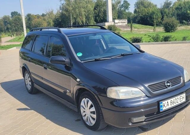 Черный Опель Астра, объемом двигателя 1.6 л и пробегом 292 тыс. км за 3500 $, фото 3 на Automoto.ua