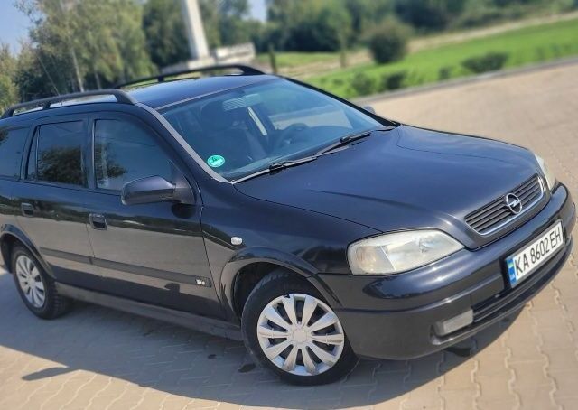 Черный Опель Астра, объемом двигателя 1.6 л и пробегом 292 тыс. км за 3500 $, фото 7 на Automoto.ua