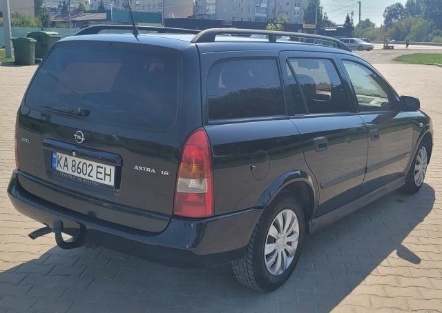 Черный Опель Астра, объемом двигателя 1.6 л и пробегом 292 тыс. км за 3500 $, фото 5 на Automoto.ua