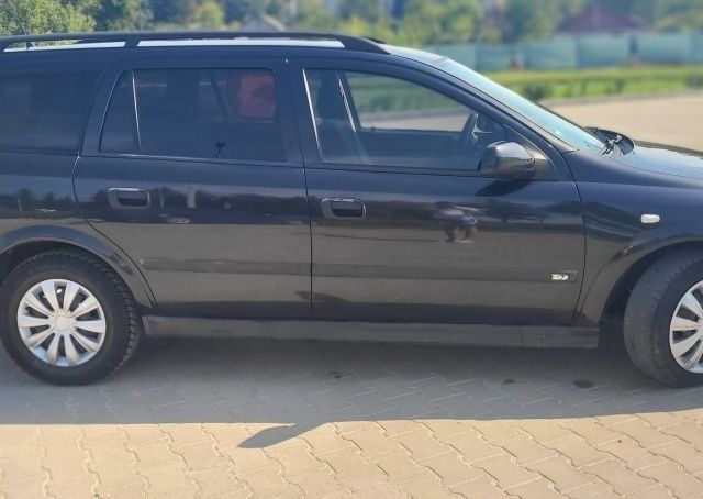 Черный Опель Астра, объемом двигателя 1.6 л и пробегом 292 тыс. км за 3500 $, фото 10 на Automoto.ua