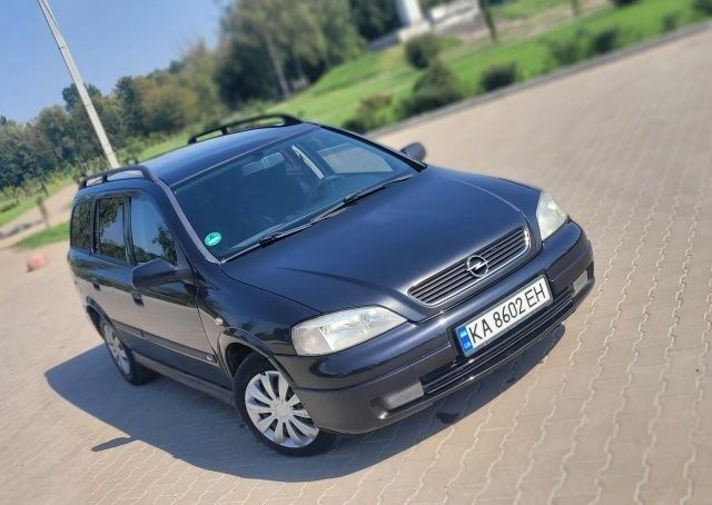 Черный Опель Астра, объемом двигателя 1.6 л и пробегом 292 тыс. км за 3500 $, фото 13 на Automoto.ua