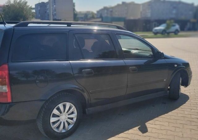 Черный Опель Астра, объемом двигателя 1.6 л и пробегом 292 тыс. км за 3500 $, фото 17 на Automoto.ua